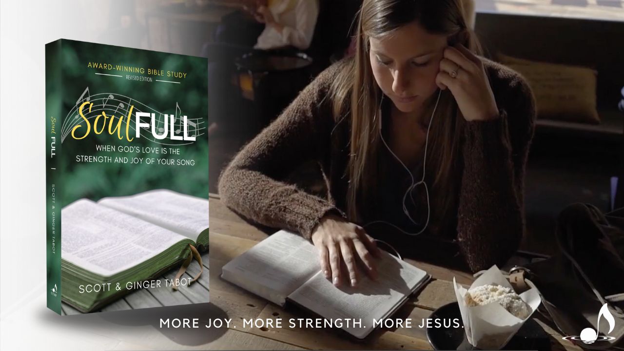 girl listening to music while reading Bible